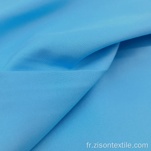 Tissus bleu pongé en polyester uni teint doux pour la peau